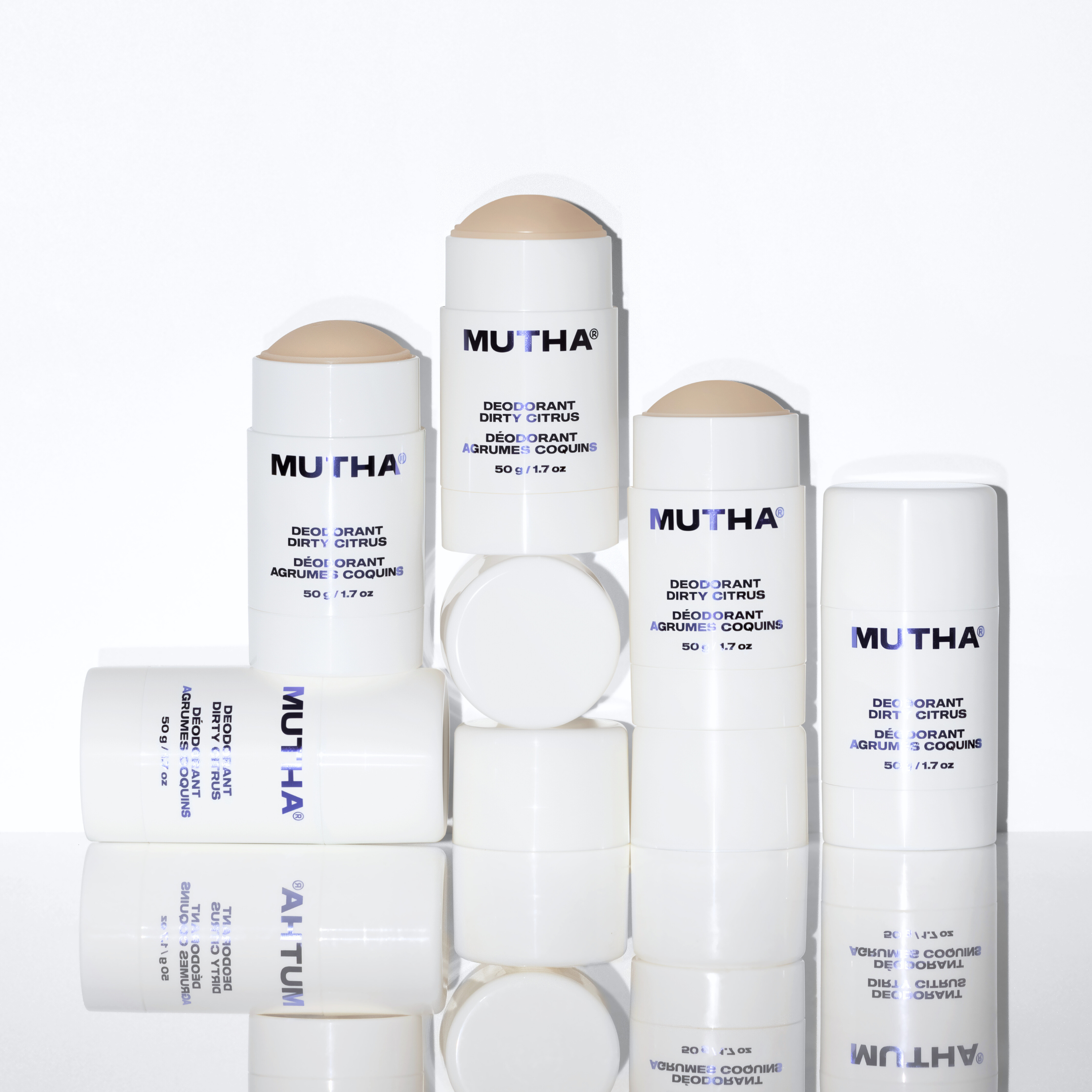 Dynamic image of five MUTHA Deodorants stacked on one another and their caps into a pyramid