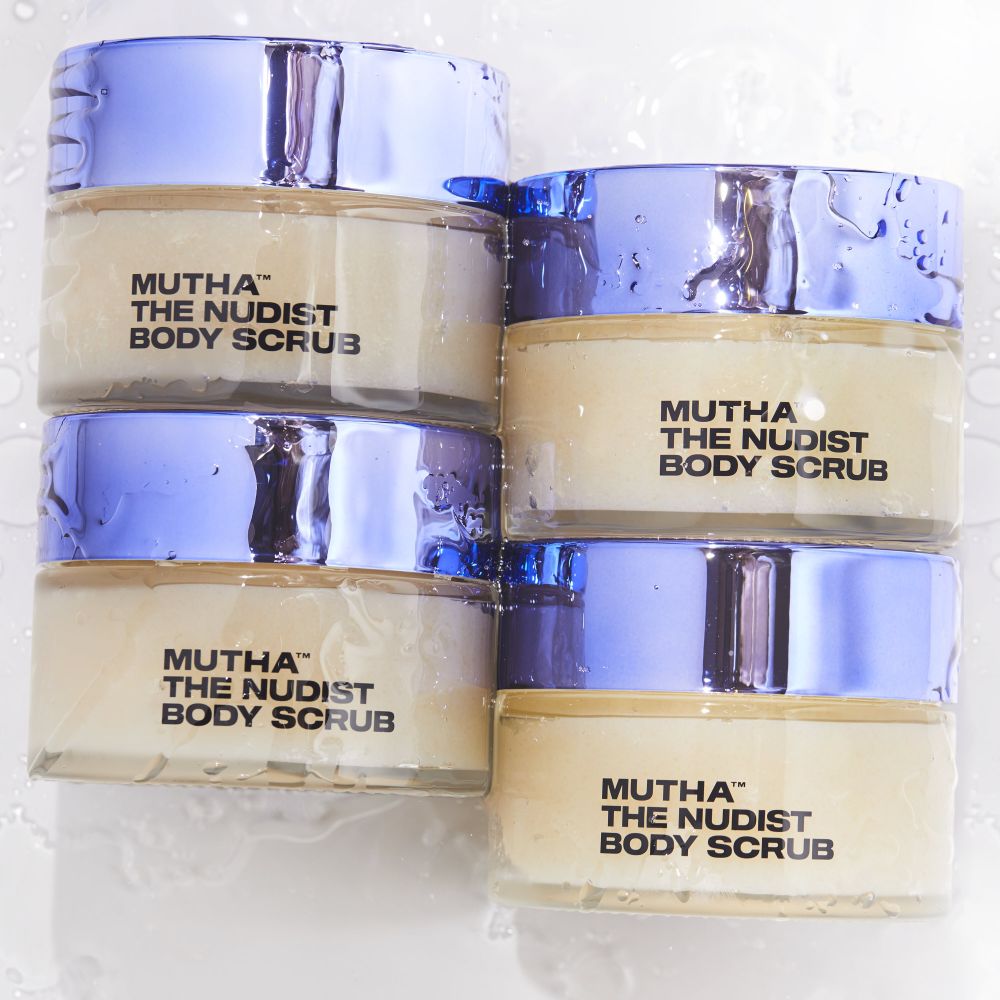 Four jars of Mutha The Nudist Body Scrub stacked on a white background