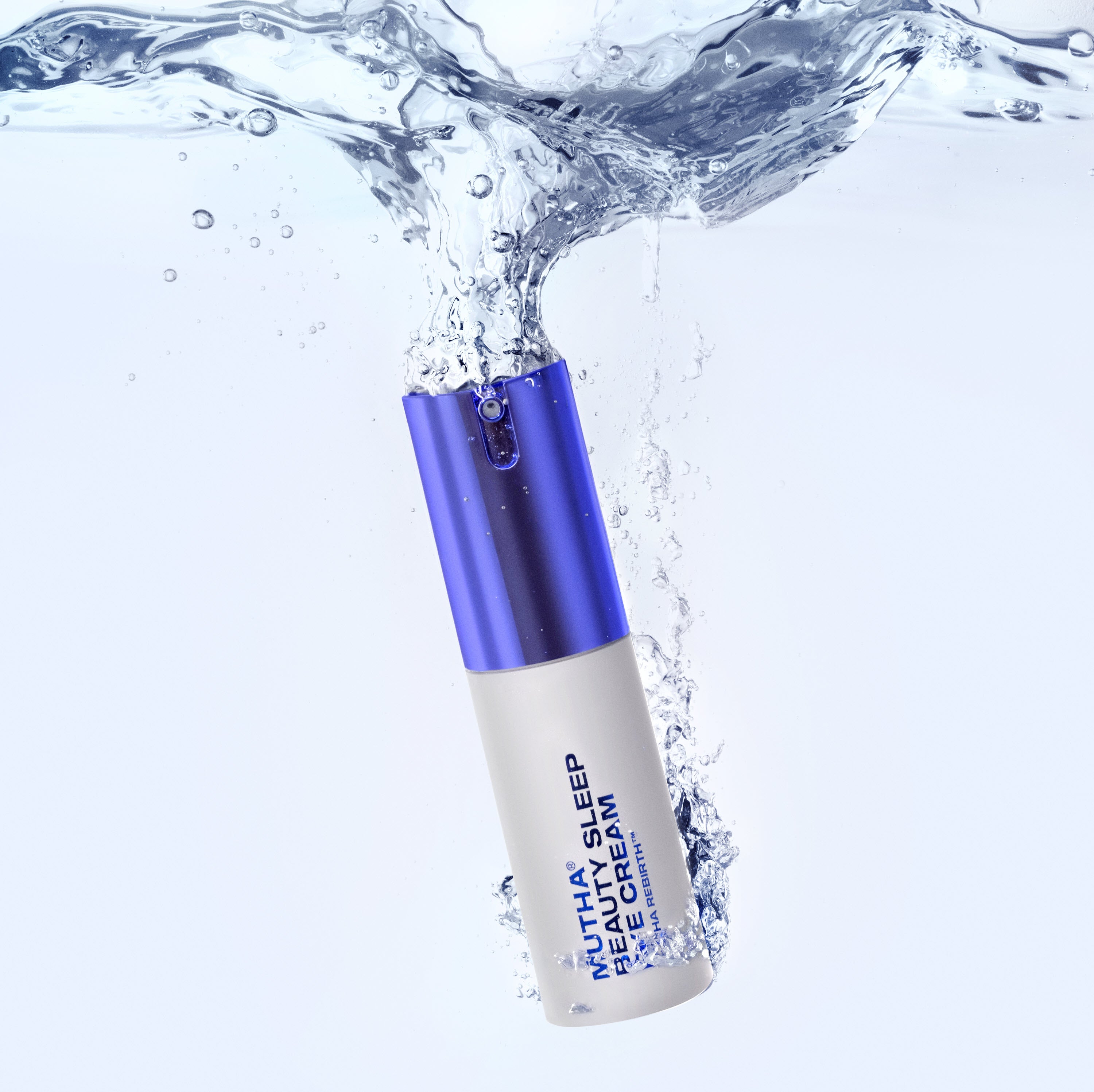 Bottle of MUTHA Beauty Sleep Eye Cream submerged underwater